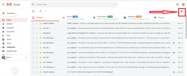 Gmail inbox with an arrow pointing to the gear icon at the top right