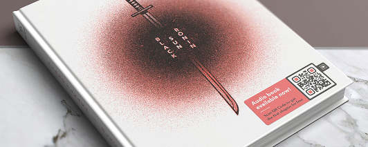 Book cover with a QR code to download the audiobook