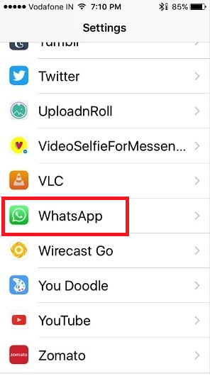 iPhone Settings app list with WhatsApp highlighted