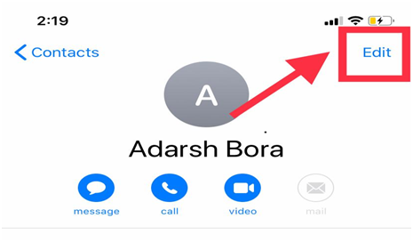 iPhone contact card with an arrow pointing to the Edit button