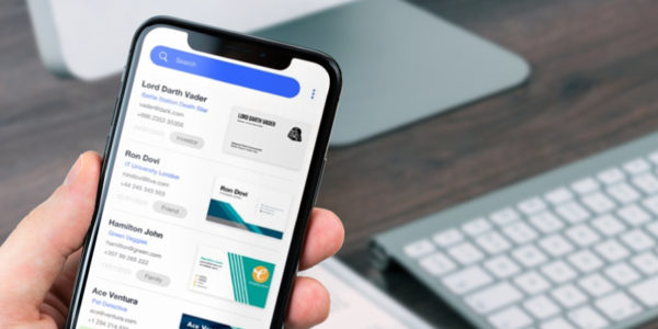 Covve Scan on an iPhone listing contacts with their scanned business cards